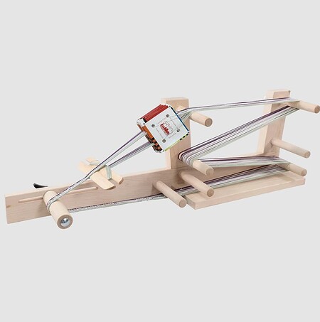 The Schacht Inkle loom shown with optional card weaving cards.